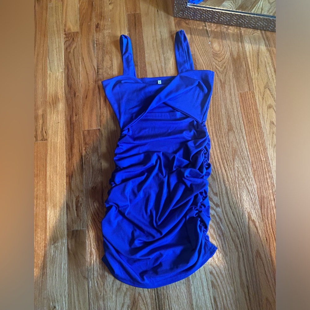 Royal blue mini dress with middle cut out, size medium.